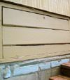 an old-fashioned crawl space door in Gypsum  about to be replaced