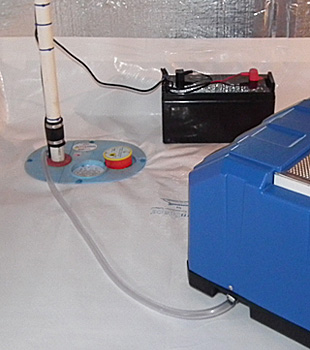 Closeup of a crawl space sump pump installed in Aspen 