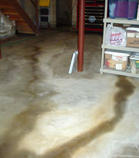 Flooding entering a basement through a floor crack in Parachute 