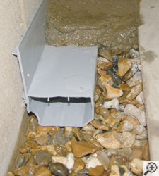A no-clog basement french drain system installed in Aspen 